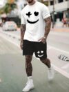 Model wearing the Newness Urban Edge Smiley Face Shorts Set a trendy mens outfit featuring a stylish smiley face graphic and comfortable modern fit perfect for vacation or workouts