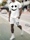 Model wearing the Newness Urban Edge Smiley Face Shorts Set a trendy mens outfit featuring a stylish smiley face graphic and comfortable modern fit perfect for vacation or workouts