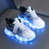 Kids GUANGLAN Nova Glow Shoes lighting up at night showcasing their lightweight and durable design Perfect for nighttime play and adventures