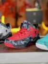 Stylish and comfortable Rebellious Splatter Paint Shoes from Newness Durable breathable sneakers with a trendy splatter paint design perfect for young trendsetters