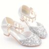 A pair of elegant Starlight Sparkle Girls Princess Heels perfect for weddings and special events The shoes feature sparkling embellishments and a delicate design