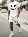 Model wearing the Newness Urban Edge Smiley Face Shorts Set a trendy mens outfit featuring a stylish smiley face graphic and comfortable modern fit perfect for vacation or workouts
