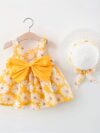 Baby girl wearing adorable Newness Sunny Days floral print dress