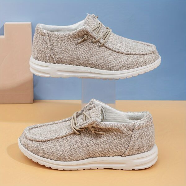 Stylish and comfortable Newness kids canvas loafers perfect for summer adventures Image shows childrens feet wearing the loafers