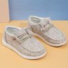 Stylish and comfortable Newness kids canvas loafers perfect for summer adventures Image shows childrens feet wearing the loafers