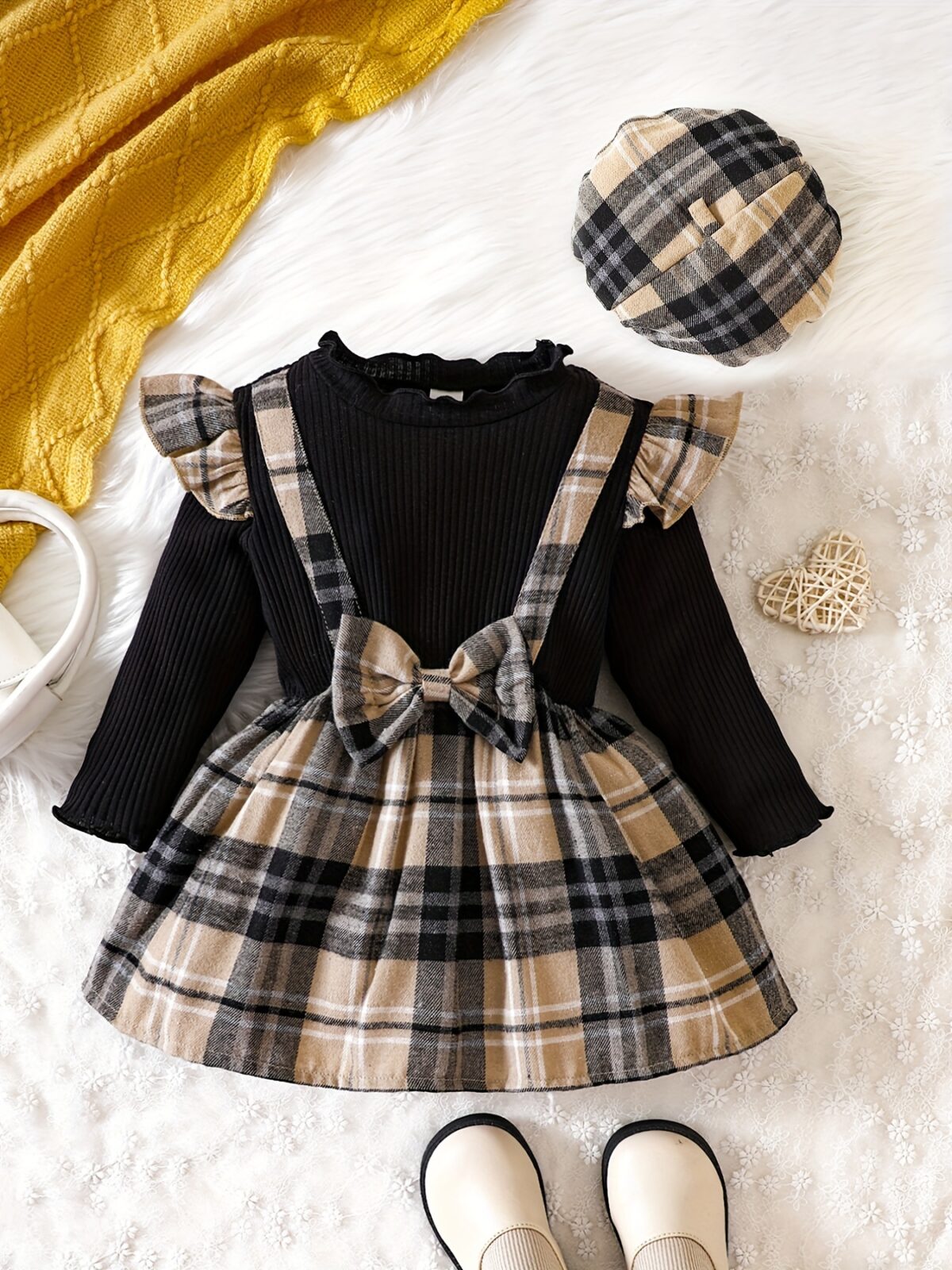 Adorable girl wearing a red and white plaid dress and matching beret Perfect for spring or fall
