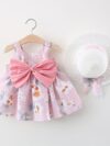 Baby girl wearing adorable Newness Sunny Days floral print dress