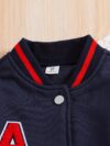 Stylish preppy varsity jacket and skirt set in navy and cream modeled on a student in a school setting