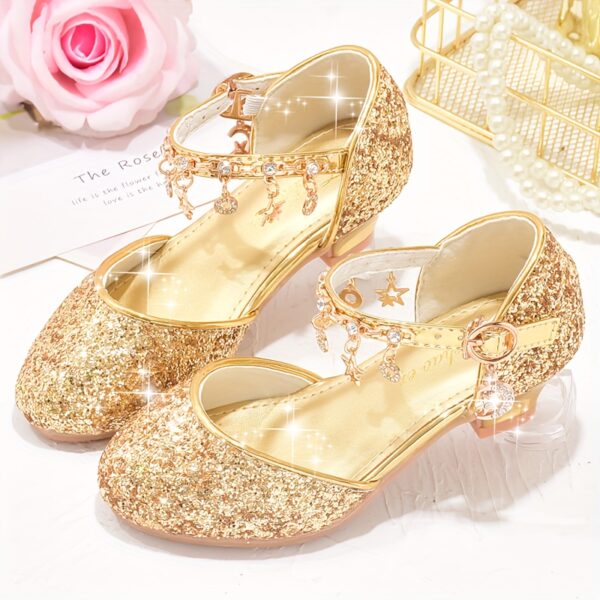 A pair of elegant Starlight Sparkle Girls Princess Heels perfect for weddings and special events The shoes feature sparkling embellishments and a delicate design