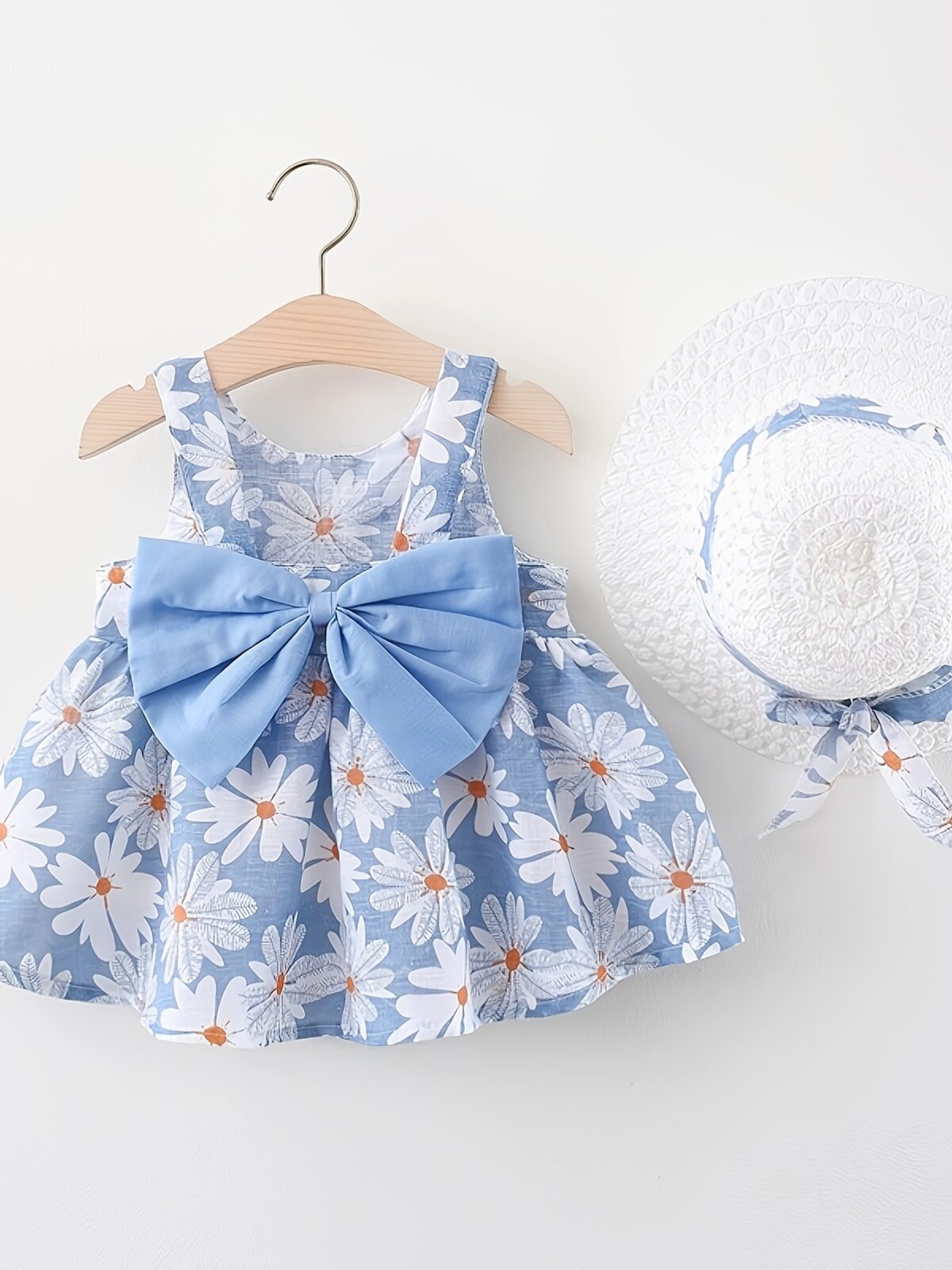 Baby girl wearing adorable Newness Sunny Days floral print dress