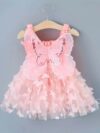 Adorable baby girl wearing a Flutterby Mesh Butterfly Dress a perfect summer outfit from Newness
