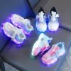 Kids GUANGLAN Nova Glow Shoes lighting up at night showcasing their lightweight and durable design Perfect for nighttime play and adventures