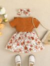 Adorable baby girl wearing a Summer Bloom floral dress perfect for summer