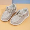 Stylish and comfortable Newness kids canvas loafers perfect for summer adventures Image shows childrens feet wearing the loafers