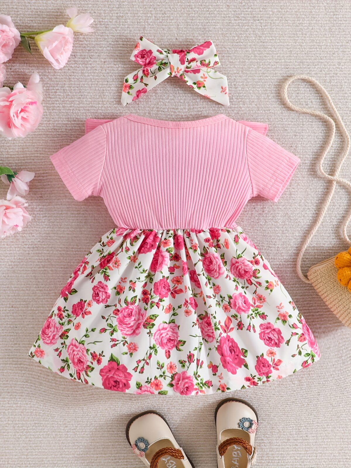 Adorable baby girl wearing a Summer Bloom floral dress perfect for summer