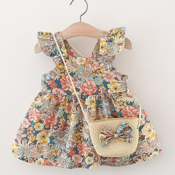 A charming girl 0 3 years twirling in a delightful summer garden floral print dress from Newness