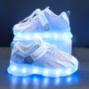 Kids GUANGLAN Nova Glow Shoes lighting up at night showcasing their lightweight and durable design Perfect for nighttime play and adventures