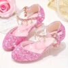 A pair of elegant Starlight Sparkle Girls Princess Heels perfect for weddings and special events The shoes feature sparkling embellishments and a delicate design