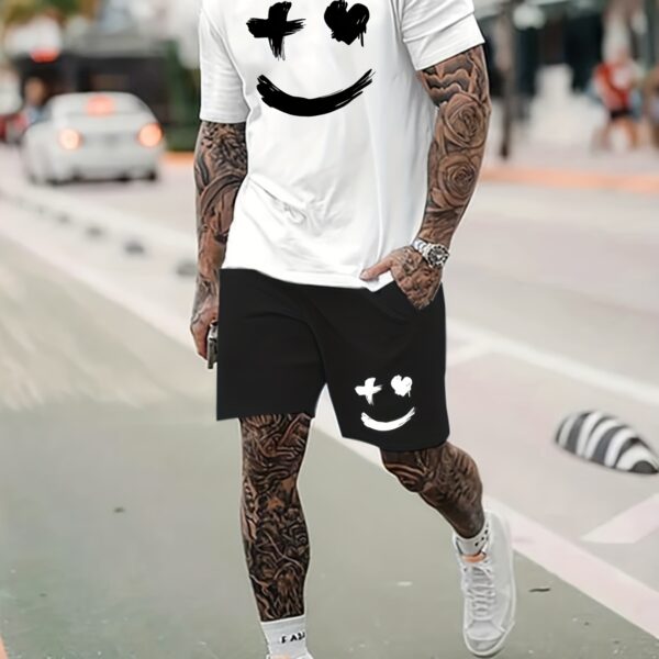 Model wearing the Newness Urban Edge Smiley Face Shorts Set a trendy mens outfit featuring a stylish smiley face graphic and comfortable modern fit perfect for vacation or workouts