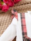 Adorable girl wearing a red and white plaid dress and matching beret Perfect for spring or fall