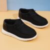 Stylish and comfortable Newness kids canvas loafers perfect for summer adventures Image shows childrens feet wearing the loafers