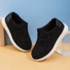 Stylish and comfortable Newness kids canvas loafers perfect for summer adventures Image shows childrens feet wearing the loafers