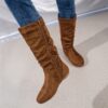 Effortlessly Chic Slouchy Boots in brown leather These stylish boots feature a slouchy fit and sleek design perfect for elevating any outfit