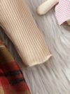 Adorable girl wearing a red and white plaid dress and matching beret Perfect for spring or fall