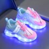 Kids GUANGLAN Nova Glow Shoes lighting up at night showcasing their lightweight and durable design Perfect for nighttime play and adventures
