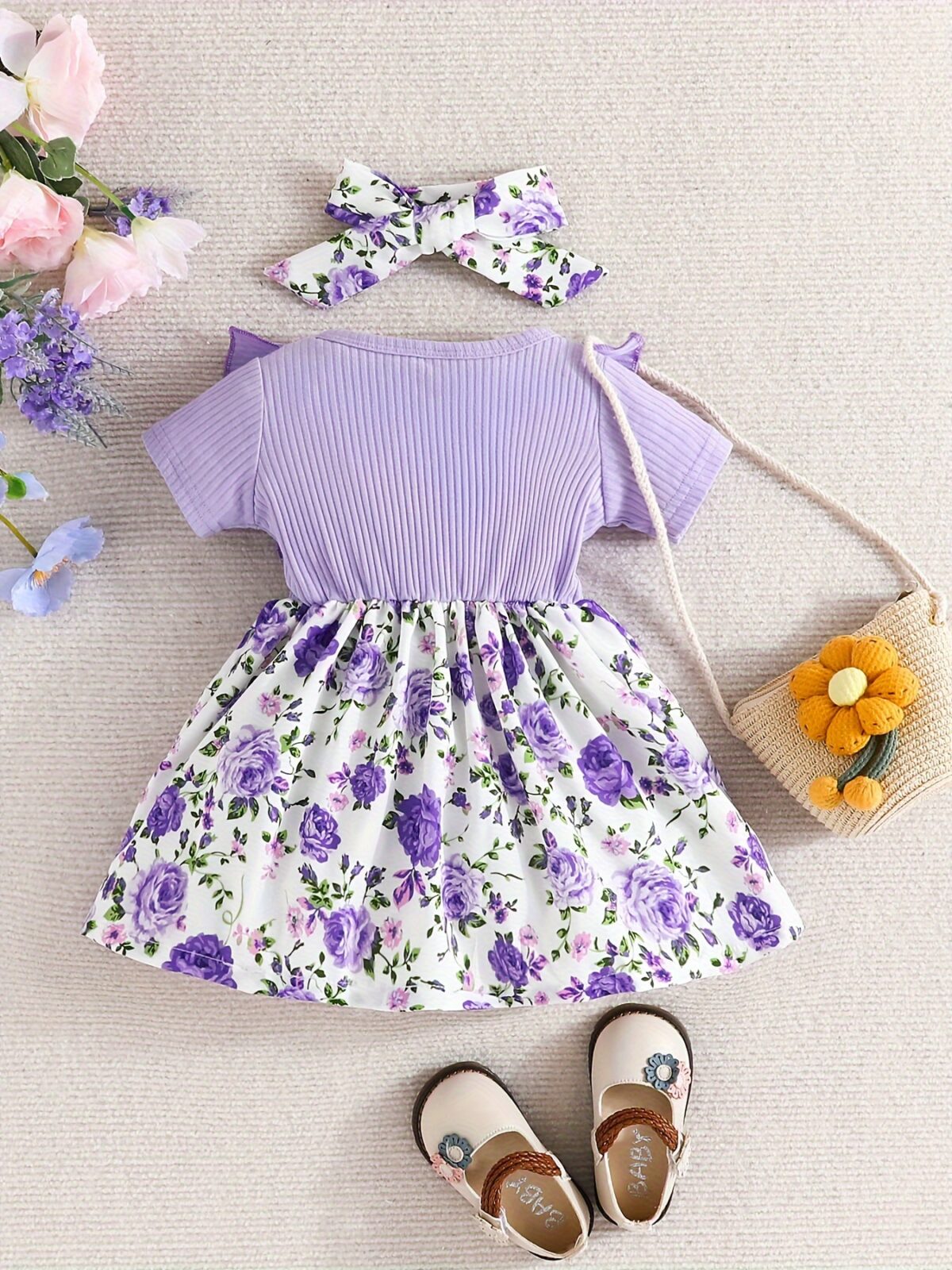 Adorable baby girl wearing a Summer Bloom floral dress perfect for summer