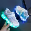 Kids GUANGLAN Nova Glow Shoes lighting up at night showcasing their lightweight and durable design Perfect for nighttime play and adventures