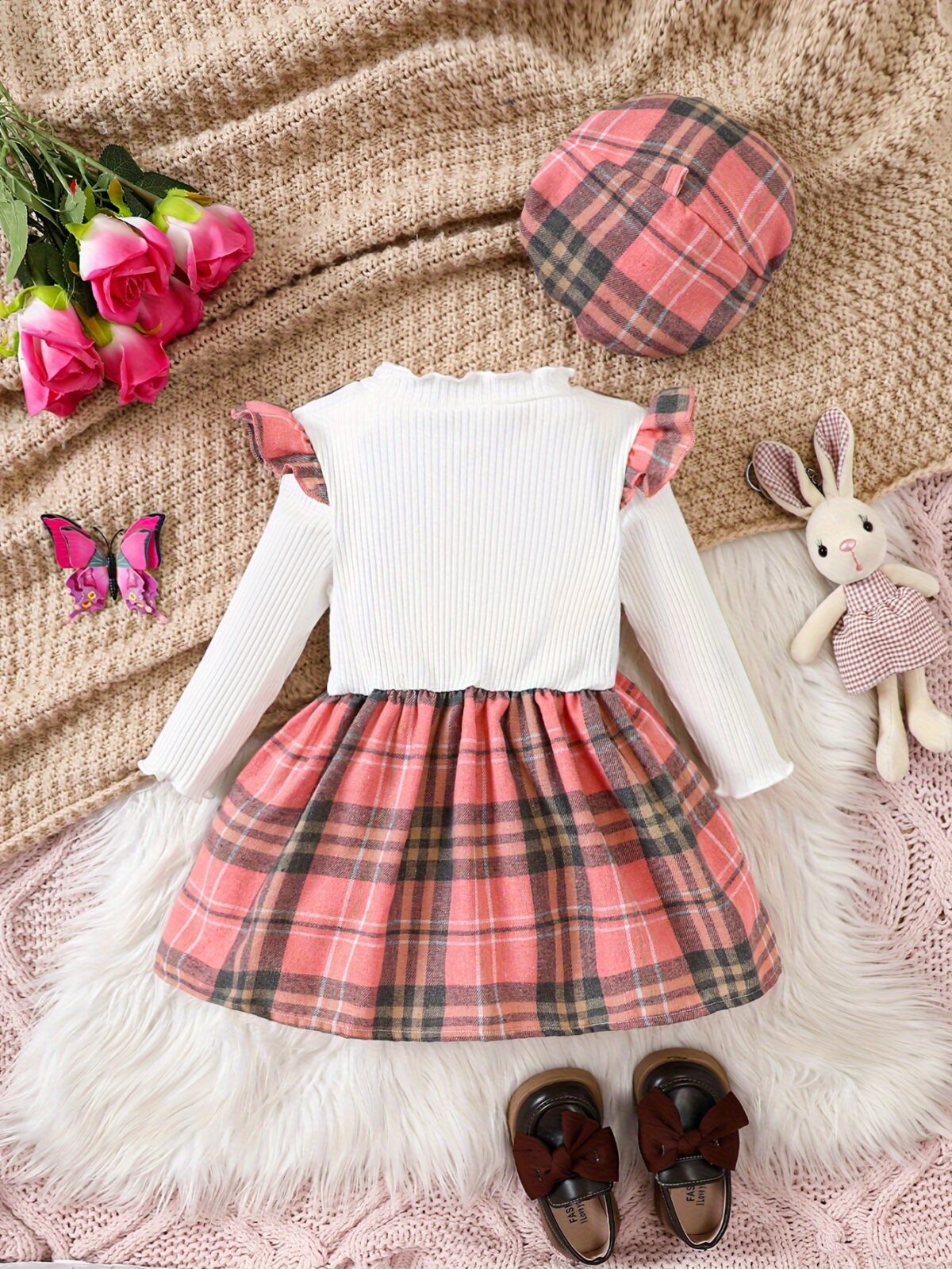 Adorable girl wearing a red and white plaid dress and matching beret Perfect for spring or fall