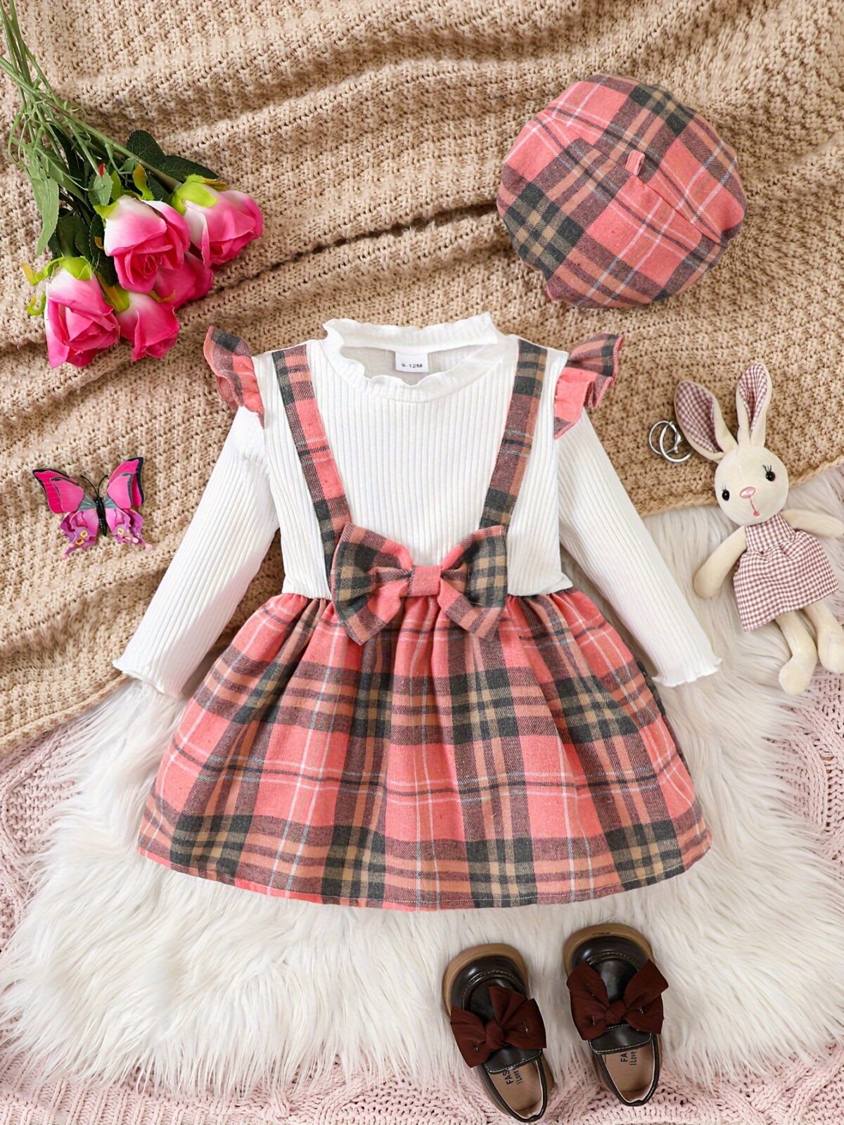 Adorable girl wearing a red and white plaid dress and matching beret Perfect for spring or fall