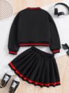 Stylish preppy varsity jacket and skirt set in navy and cream modeled on a student in a school setting