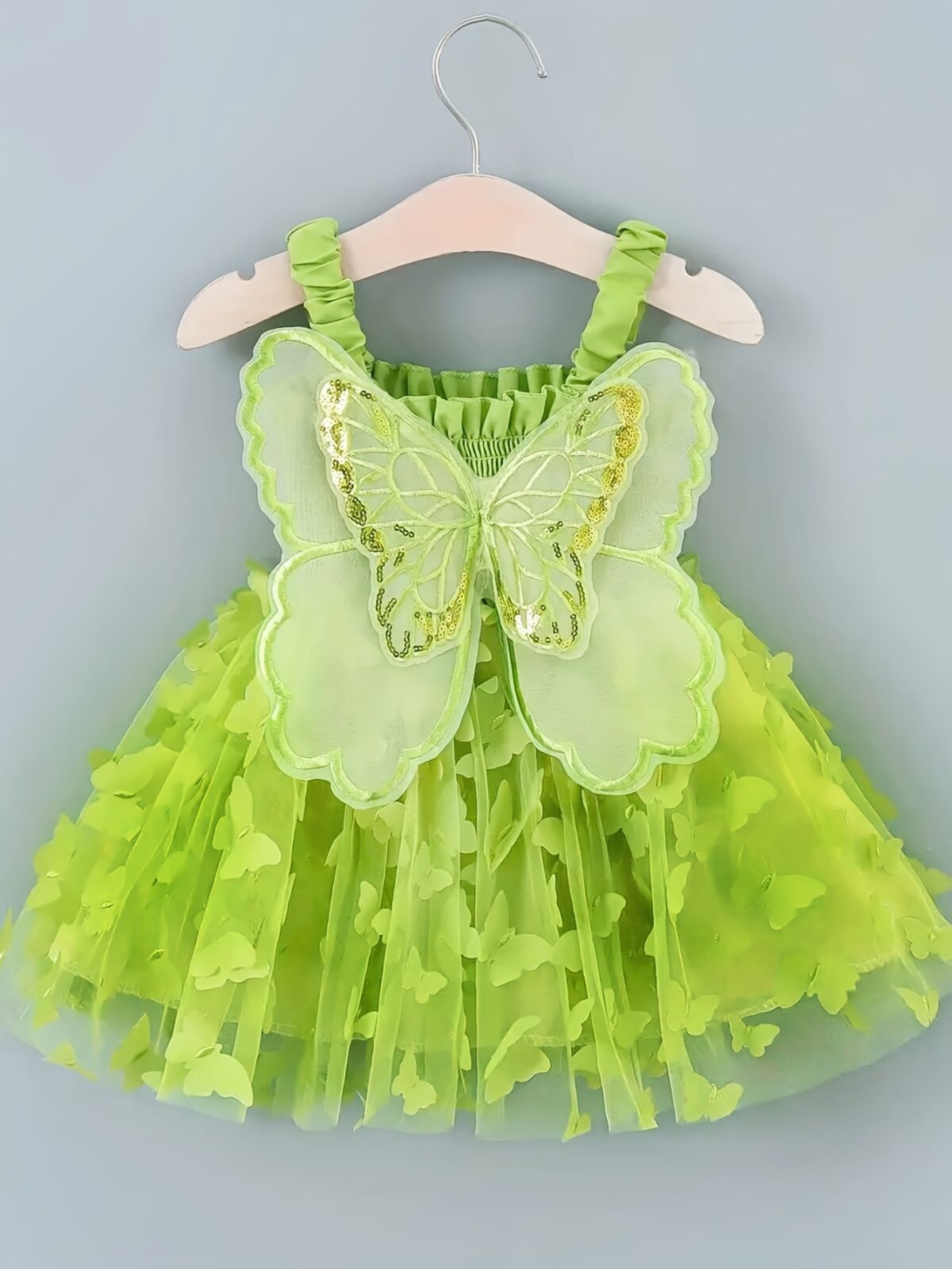 Adorable baby girl wearing a Flutterby Mesh Butterfly Dress a perfect summer outfit from Newness