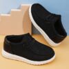 Stylish and comfortable Newness kids canvas loafers perfect for summer adventures Image shows childrens feet wearing the loafers