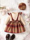 Adorable girl wearing a red and white plaid dress and matching beret Perfect for spring or fall