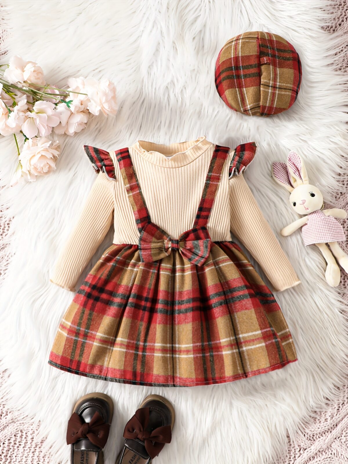Adorable girl wearing a red and white plaid dress and matching beret Perfect for spring or fall