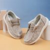 Stylish and comfortable Newness kids canvas loafers perfect for summer adventures Image shows childrens feet wearing the loafers