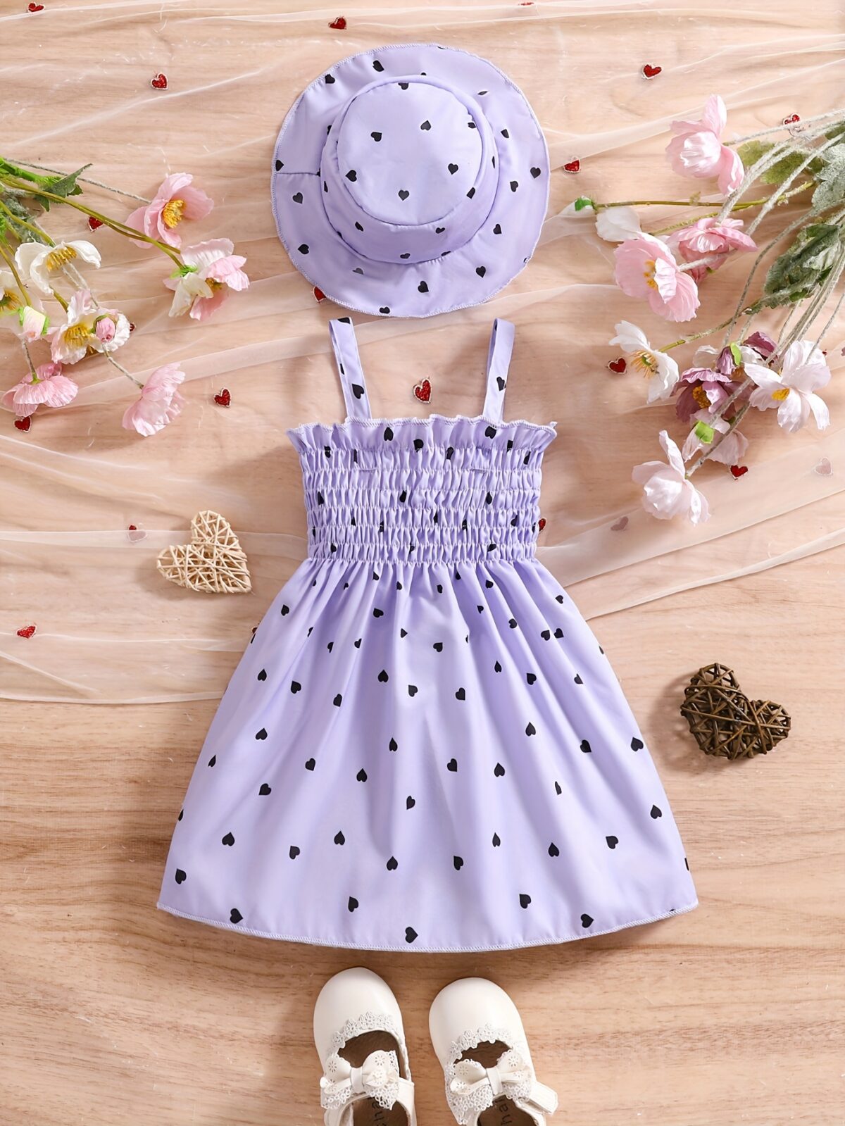 Girl wearing adorable Summer Bloom heart print dress and matching hat set