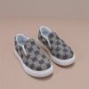 Stylish and comfortable Newness Little Wanderer Kids Canvas Shoes in white perfect for spring adventures The shoes feature a classic canvas design with a comfortable fit