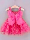 Adorable baby girl wearing a Flutterby Mesh Butterfly Dress a perfect summer outfit from Newness