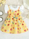 Adorable baby girl wearing a summer heart print dress perfect for school and special occasions