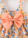 Baby girl wearing adorable Newness floral print dress and hat set perfect for summer