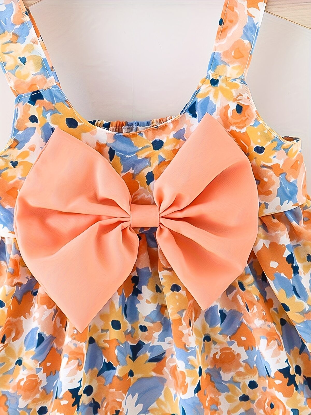 Baby girl wearing adorable Newness floral print dress and hat set perfect for summer