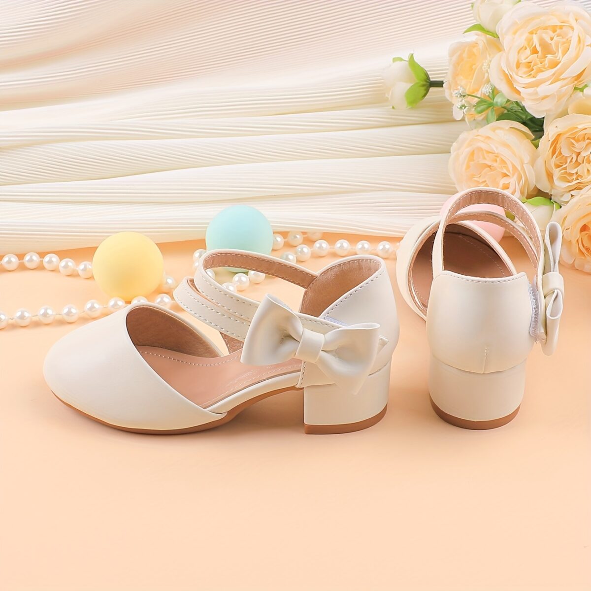 Adorable girls Mary Jane shoes with a delicate bow detail perfect for weddings parties and special occasions