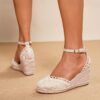 Newness Coastal Breeze Lace Up Wedge Sandals in white showcasing the intricate lace up detail and comfortable wedge heel perfect for summer