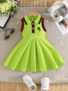 A little girl smiles while wearing a vibrant lime green dress Perfect summer outfit for girls
