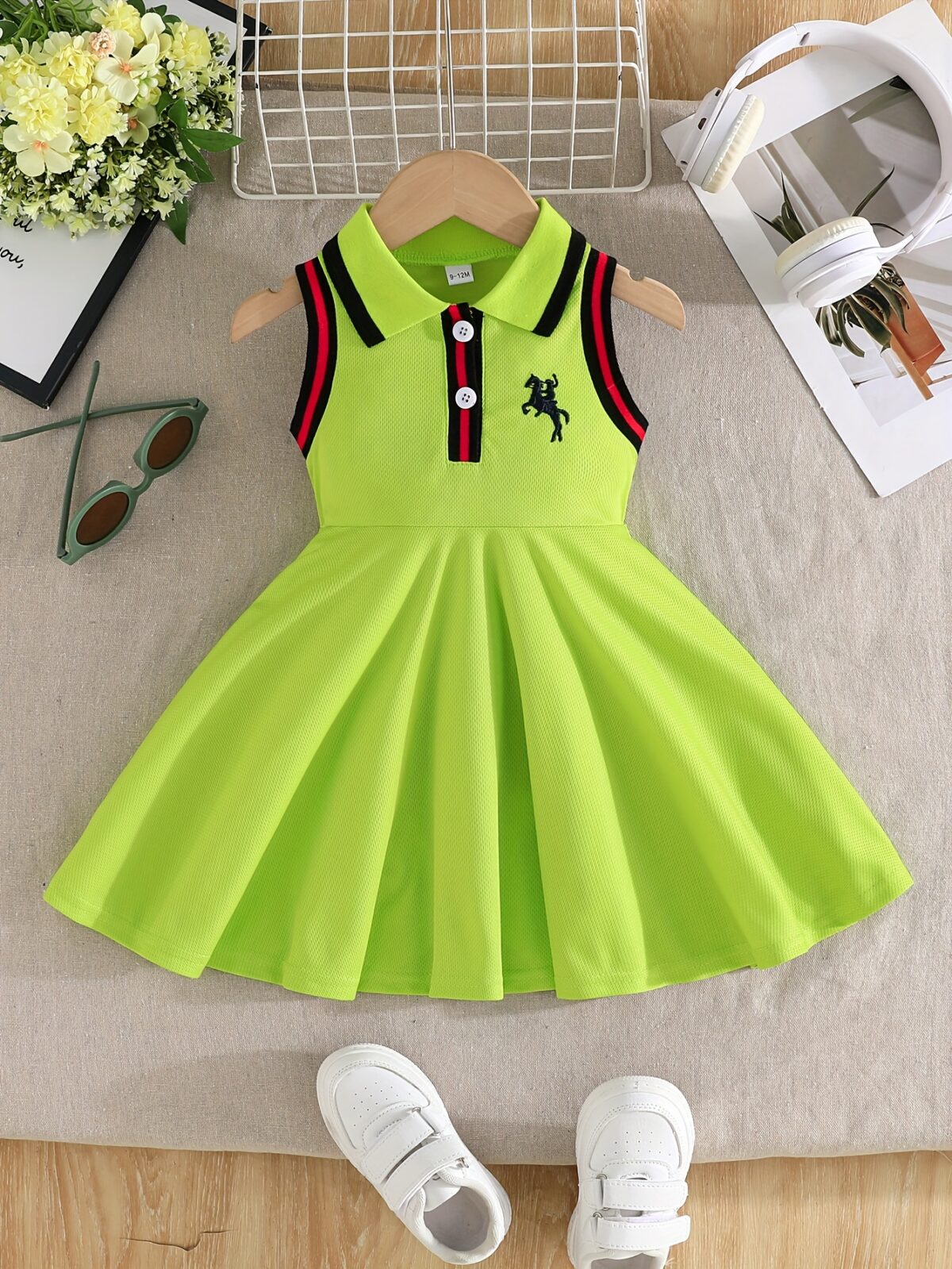 A little girl smiles while wearing a vibrant lime green dress Perfect summer outfit for girls