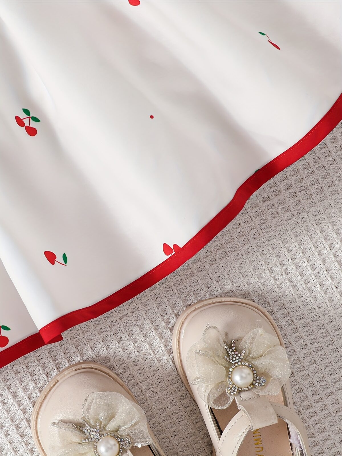 Sweet Cherry Print Dress with Bow from Newness A charming cherry printed dress with a cute bow